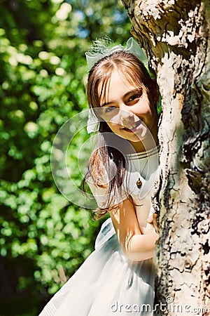 Little Girl with her First Communion Dress Stock Photo