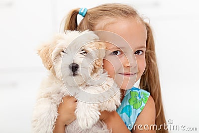 Little girl with her fluffy dog Stock Photo