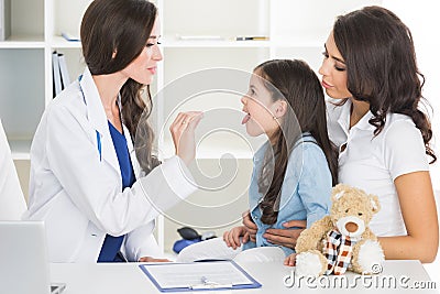 Doctor examine child`s throat Stock Photo