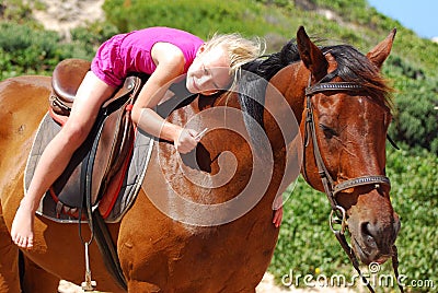 Little girl on her pony Stock Photo