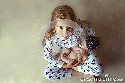 Little girl holding a baby Stock Photo