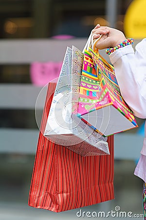 Little girl holding bags Stock Photo