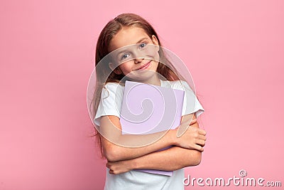 Little girl holding book, going to school Stock Photo