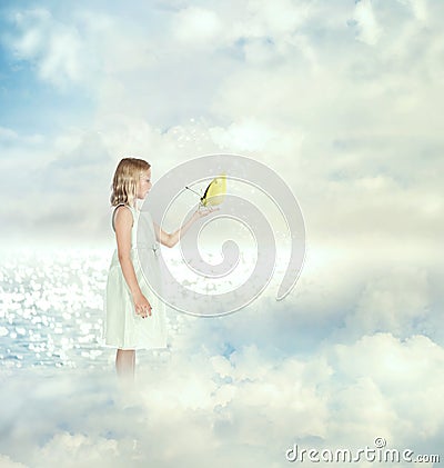 Little girl holding a butterfly Stock Photo