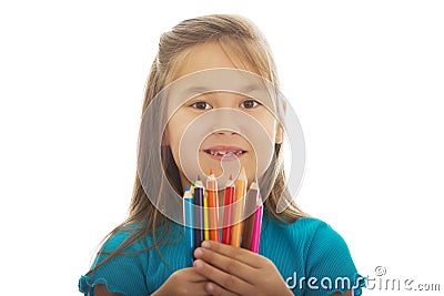 Little girl holding crayons Stock Photo