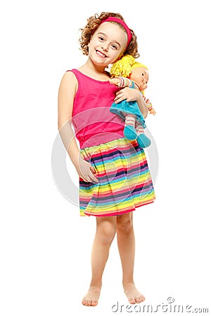 Little girl holding a doll. White background Stock Photo