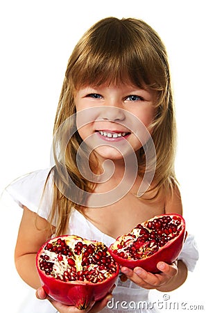 Little girl holding pomegranate Stock Photo