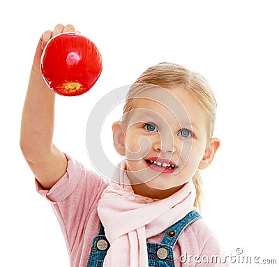 Little girl holding a red apple. Stock Photo