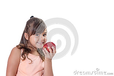 Little girl is holding a red apple in her hand Stock Photo