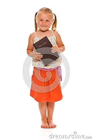 Little girl with holy bible Stock Photo