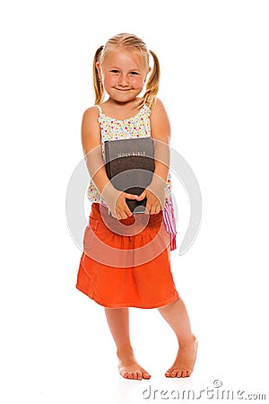 Little girl with holy bible Stock Photo