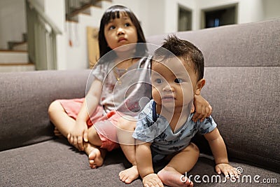 Adorable asian siblings being playful at their home stock photo Stock Photo