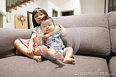 Adorable asian siblings being playful at their home stock photo Stock Photo