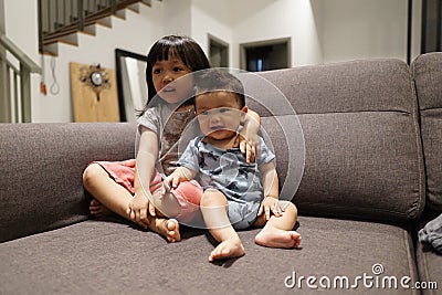 Adorable asian siblings being playful at their home stock photo Stock Photo