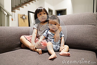 Adorable asian siblings being playful at their home stock photo Stock Photo