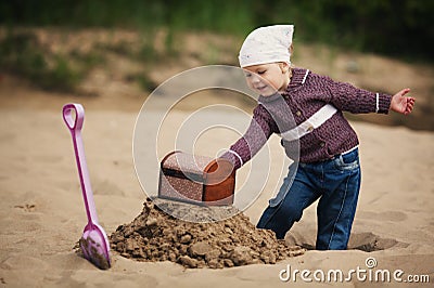 Little girl hunting for treasure Stock Photo