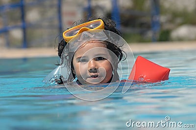 Little girl in inflatable over-sleeves floats Stock Photo