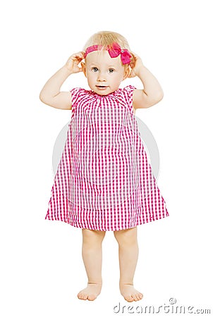 Little girl kid in red dress with bow. Child isolated on white b Stock Photo