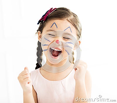 Little girl with kitty painted face Stock Photo