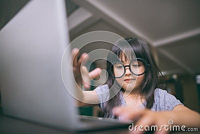 Little girl with laptop. Stock Photo