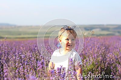 Little girl on a lavender field. Stock Photo