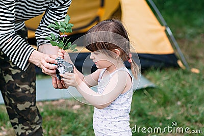 Little girl learn how to be photographer, nature Stock Photo