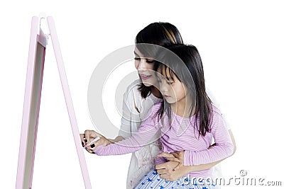 Little girl learning a write on studio Stock Photo