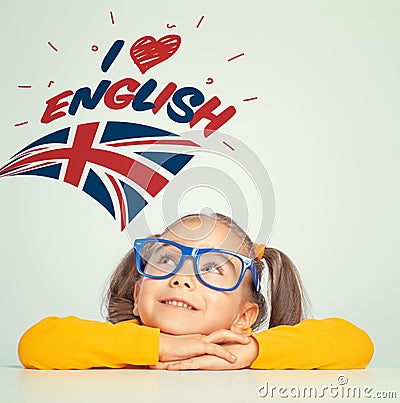 Little girl looking at i love english text and UK flag above her head Stock Photo