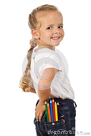 Little girl with lots of pencils in her pocket Stock Photo