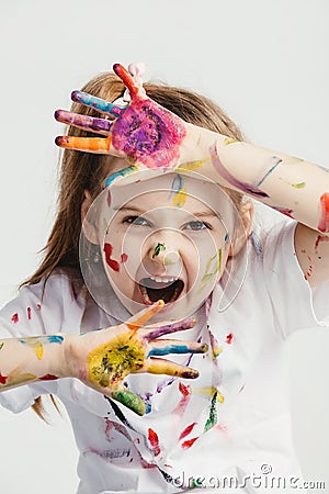 Little girl making funny faces. Stock Photo