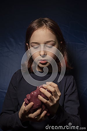 Little girl making homemade slime toy. Relax and Satisfaction Stock Photo