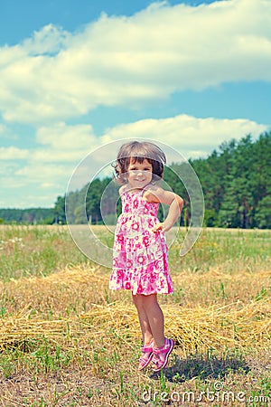 Little girl in the meadow Stock Photo