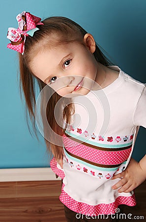 Little girl modeling hair bow and matching shirt Stock Photo