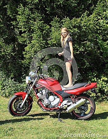 Little girl on motorbike Stock Photo