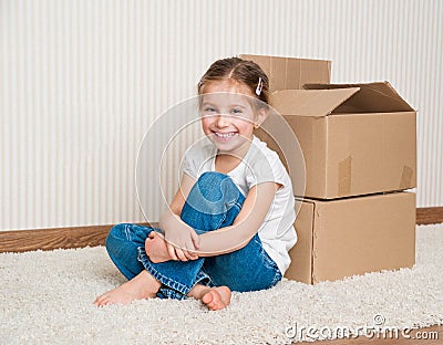 Little girl moving into new house Stock Photo