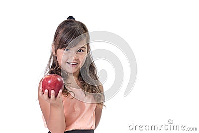 Little girl is offering a red apple in her hand Stock Photo