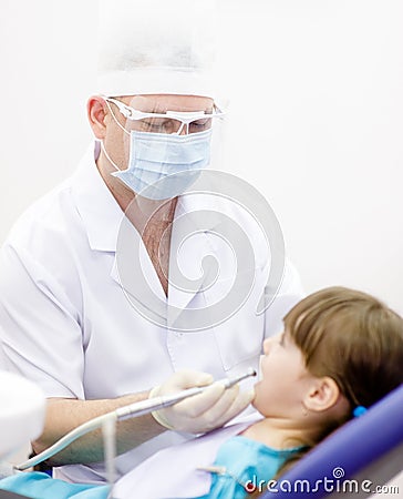 Little girl with open mouth during drilling treatm Stock Photo