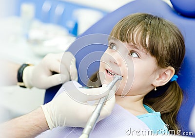 Little girl with open mouth during drilling treatm Stock Photo