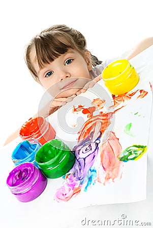 Little girl painting with finger paints Stock Photo