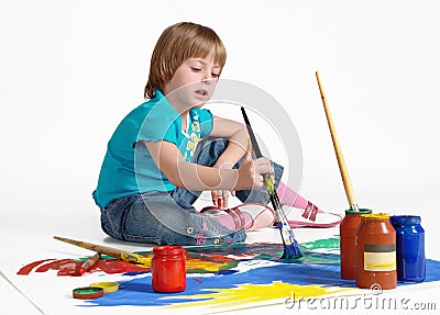 Little girl painting picture on a white background Stock Photo