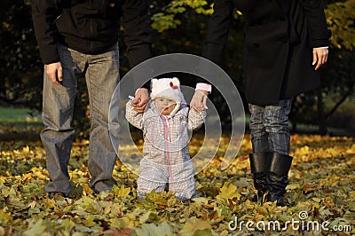 Little girl with parents Stock Photo