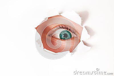 Little girl peeking through paper hole Stock Photo