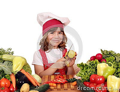 Little girl peeling potatoes Stock Photo