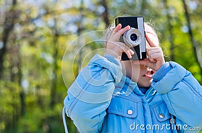 Little girl playing at amateur photography Stock Photo