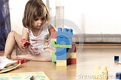 Little Girl Playing With Block Toys Stock Photo