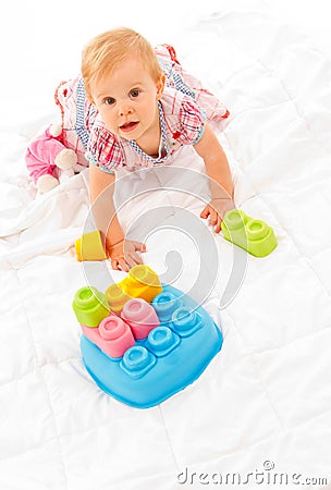 Little girl playing with building blocks Stock Photo