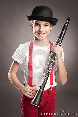 Little girl playing clarinet Stock Photo