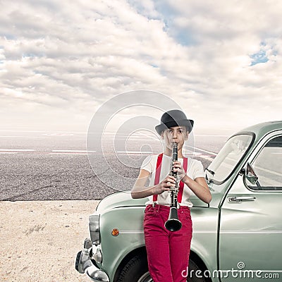 Little girl playing clarinet Stock Photo