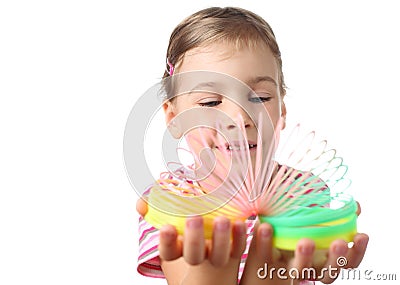 Little girl playing with colorful plastic spring Editorial Stock Photo