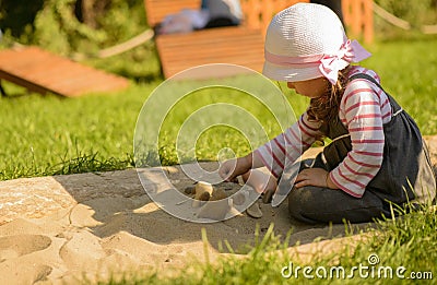 Little girl playing outdoor in sensory garden Stock Photo